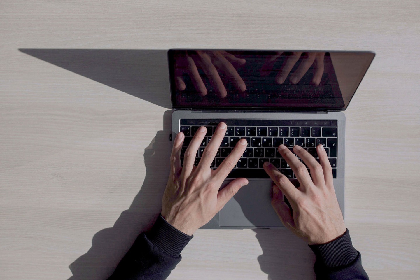 A birds-eye view of someone working on a laptop