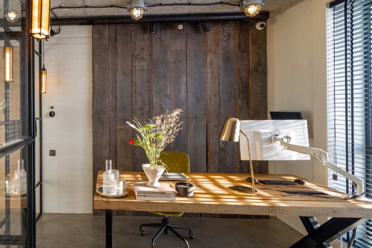 A modern open-plan workplace with people collaborating