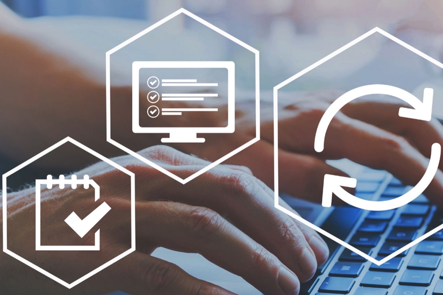 A graphic representing software deployment and updates in front of a laptop