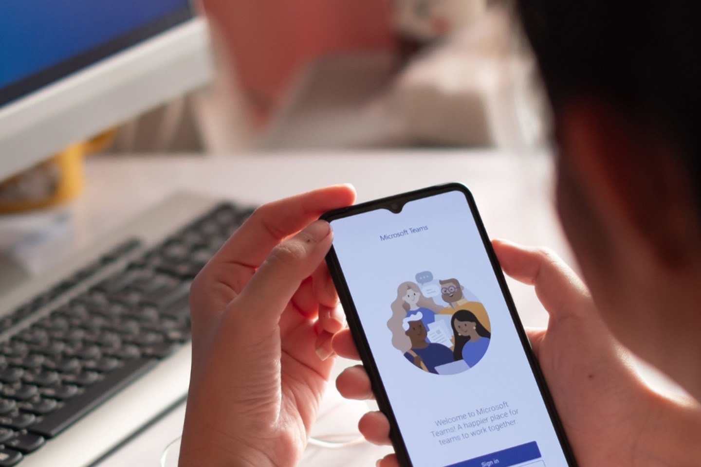 A phone showing the Microsoft Teams app